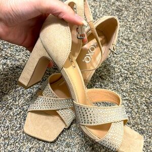 A heel shoes, the brand is xoxo.